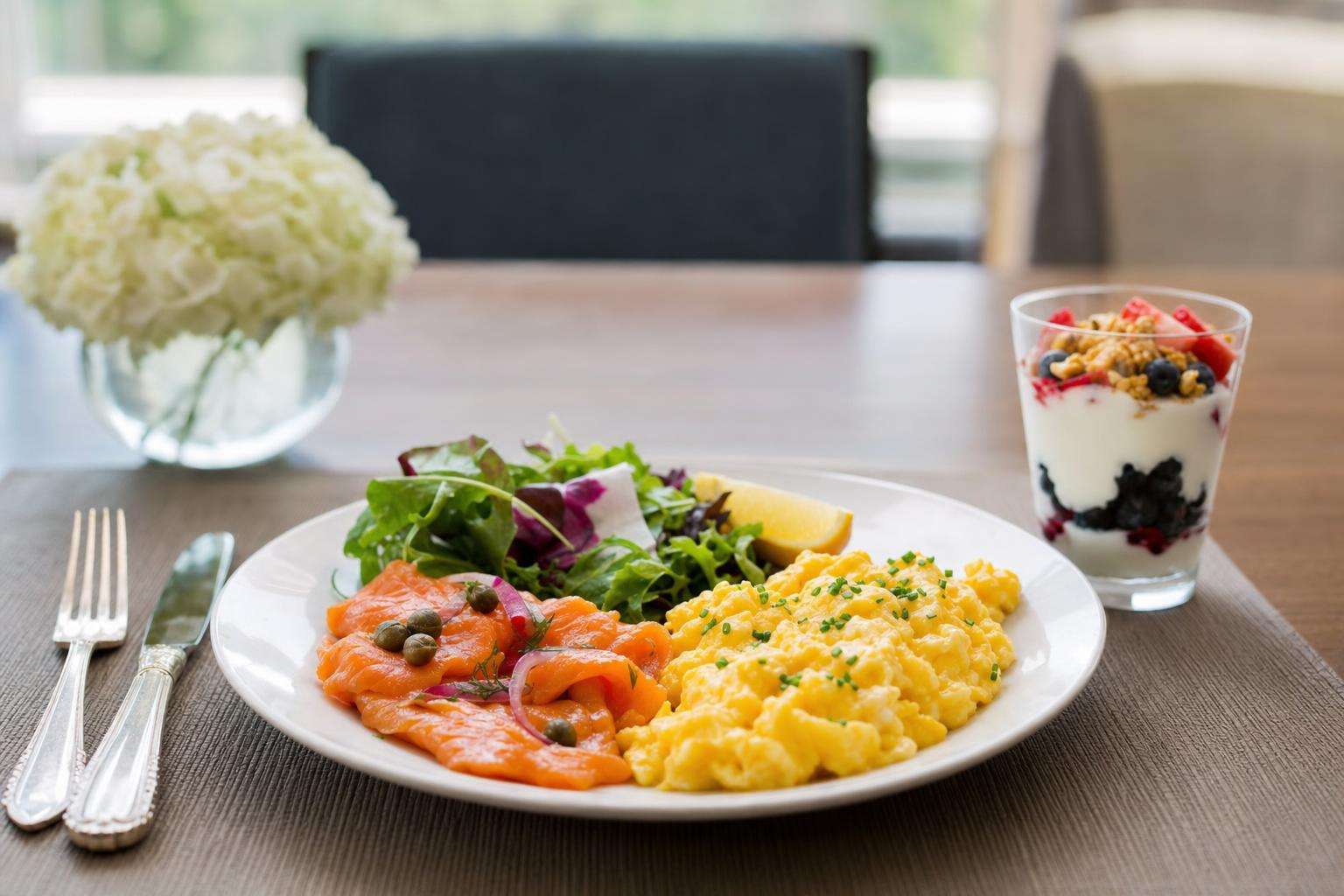 High-protein meal with eggs fish and yogurt for older adult nutrition, no people