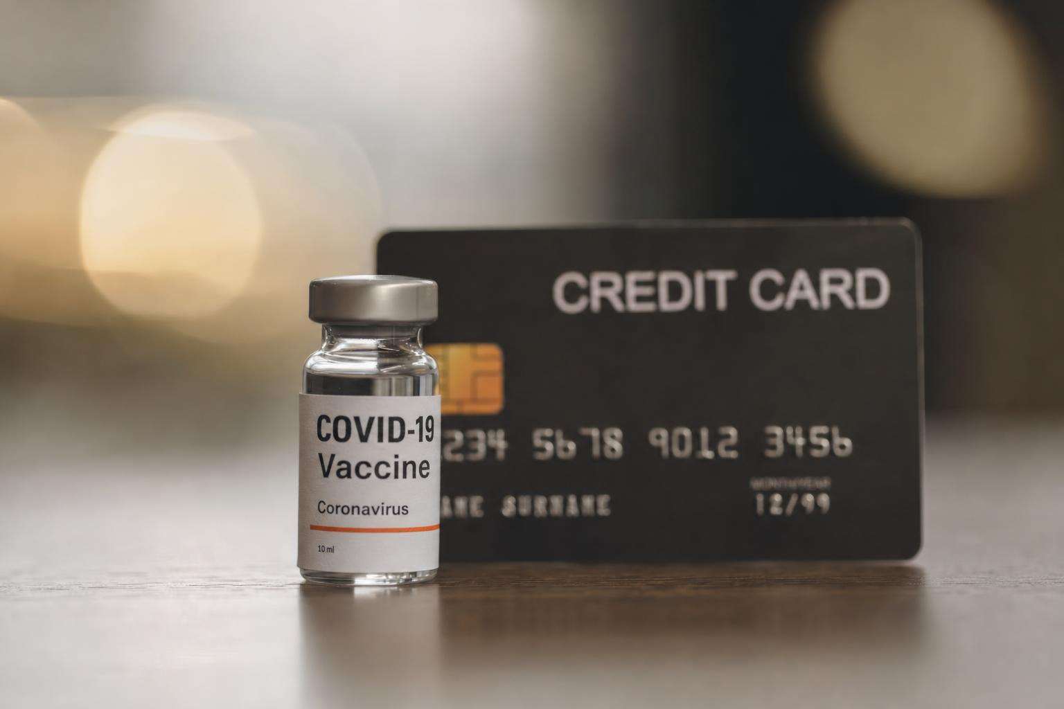 Credit card next to laboratory microplastic vial concept, soft light, no people