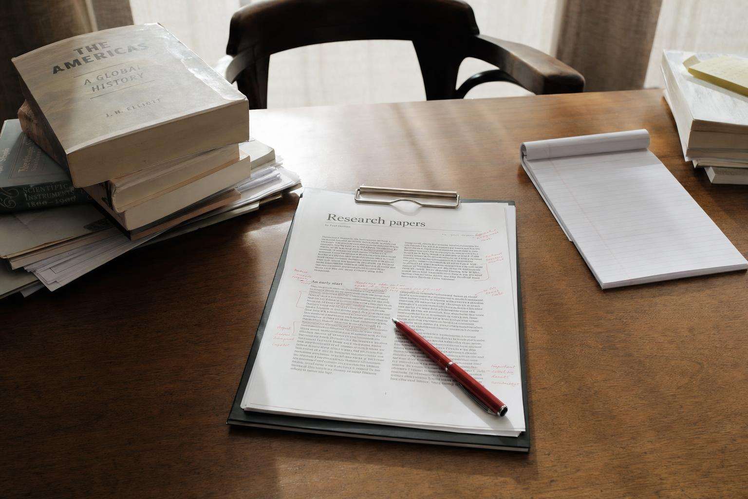 Clipboard with survey checklist beside research papers and stethoscope, no people