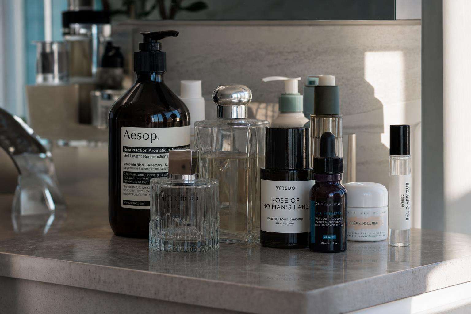 Bathroom counter with multiple personal-care bottles and an open window, no people