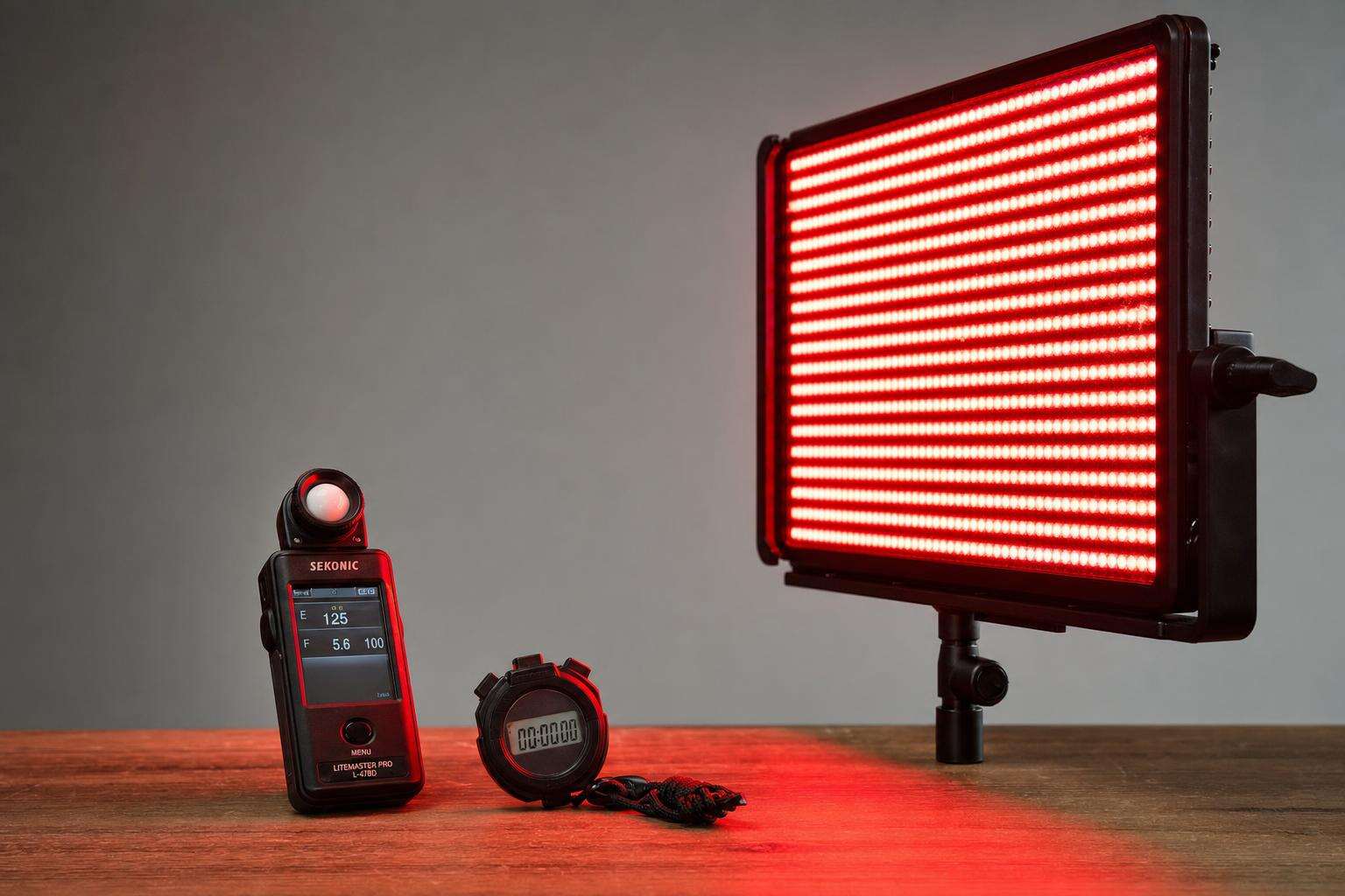 LED panel glow meter and stopwatch illustrating dose, no people
