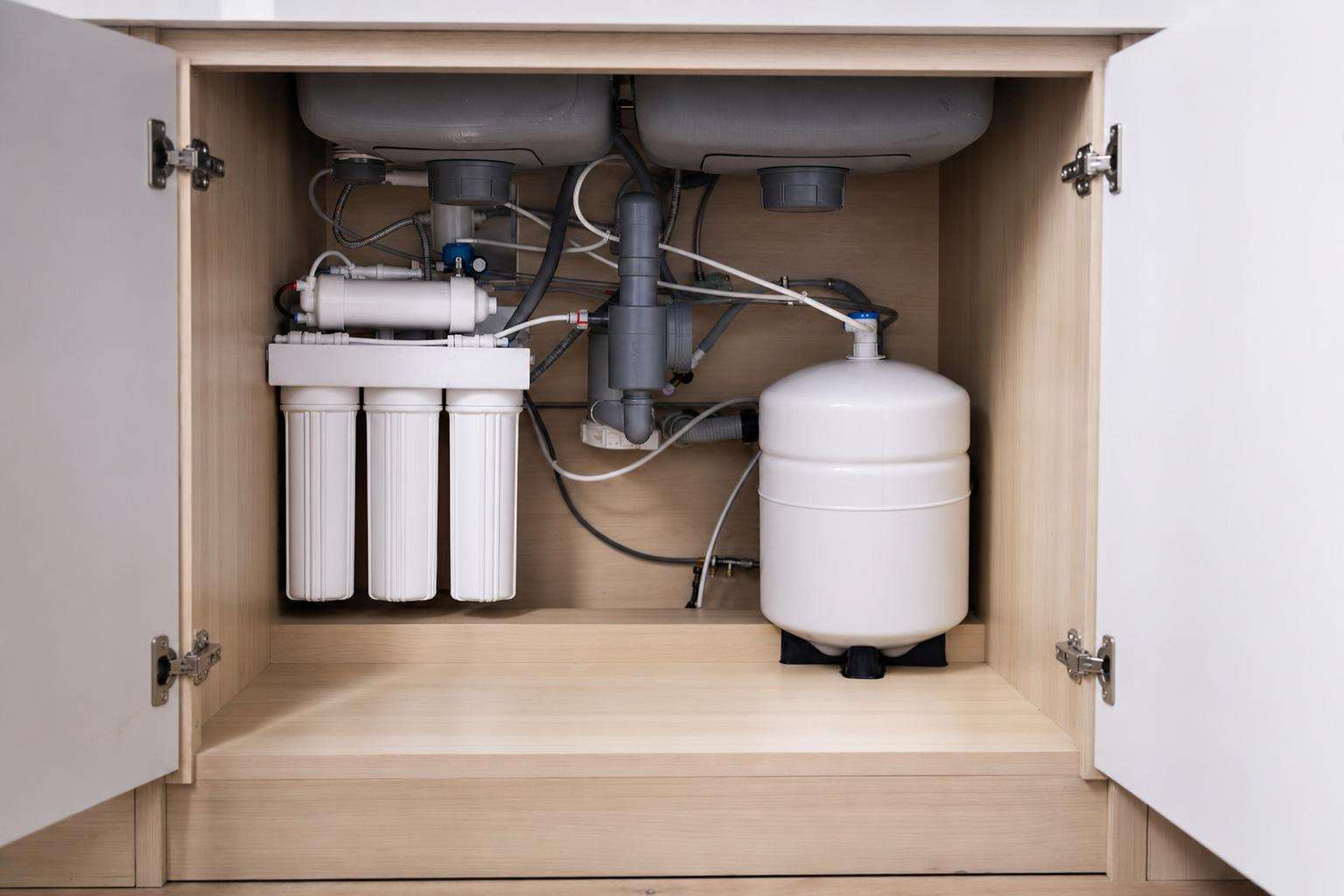 Under-sink reverse osmosis system close-up, no people