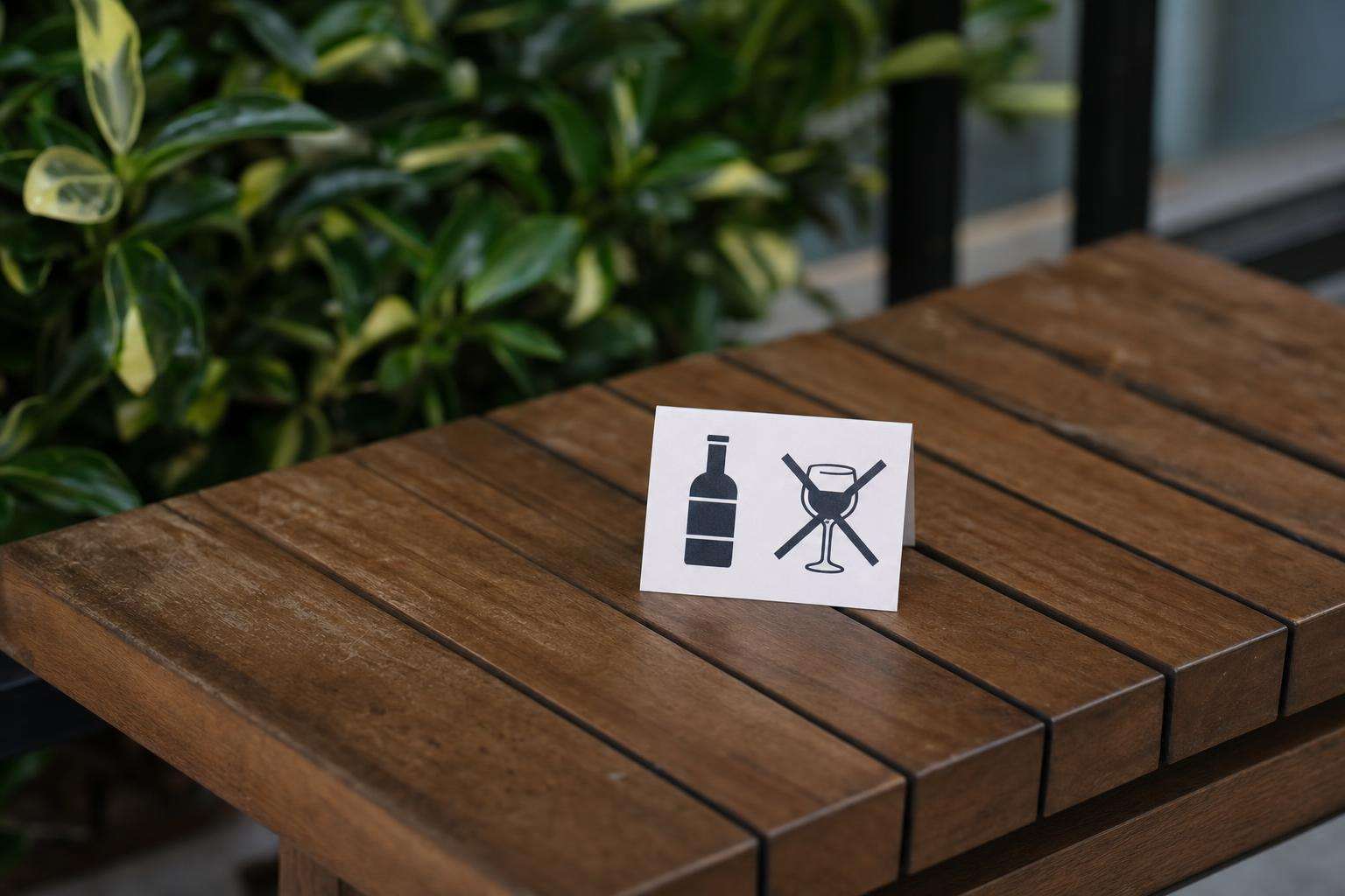 No-alcohol symbol and water bottle outside sauna, no people